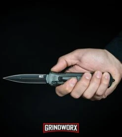 Smith & Wesson Spring Assisted Finger Actuator Spear Point OTF - Black Serr 13 Smith & Wesson Spring Assisted Finger Actuator Spear Point OTF - Black Serr -Knife Sale Shop MP OTF Spring Assisted Spear Point Knife Gray Black BHQ 80731 kp in hand web large 1